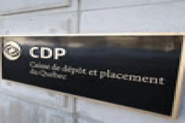 A woman walks out of the Caisse de depot et placement du Quebec head office in Quebec City