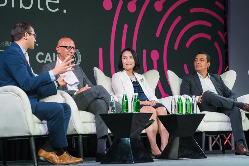 Ju Hui Lee, center, at the Cayman Alternative Investment Summit. (Courtesy photo)